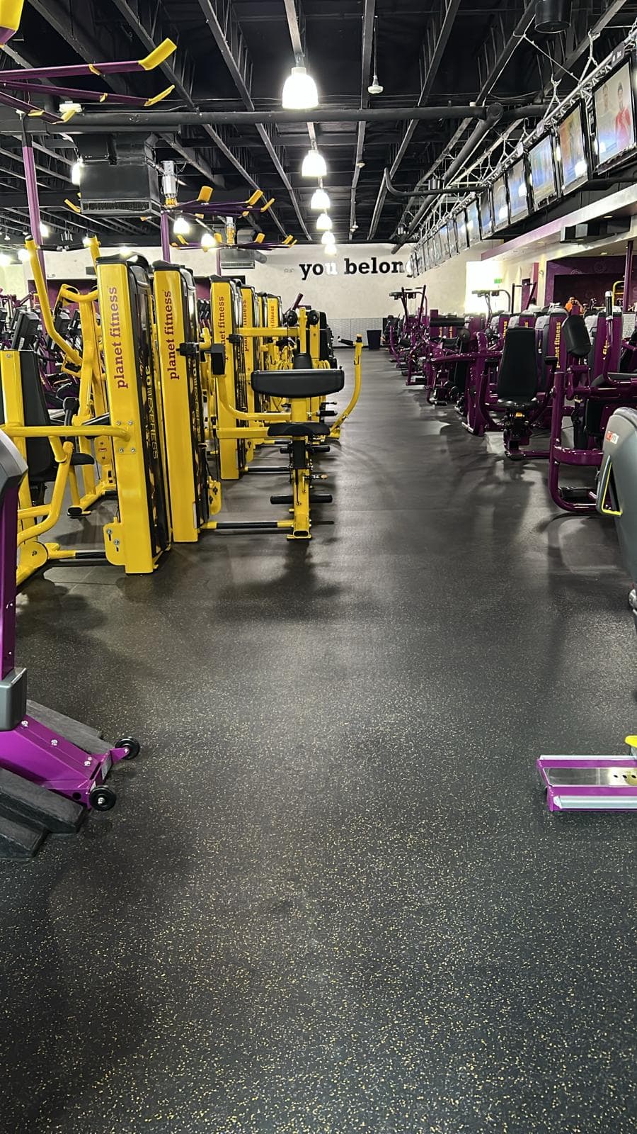 Clean Aurora gym floor with weight machines and rubber flooring