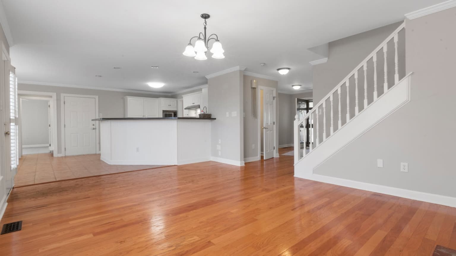 Clean hardwood floor in a bright living room