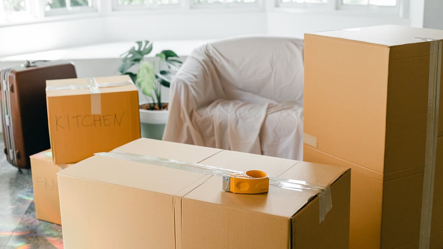 Moving boxes in a room prepared for move-out