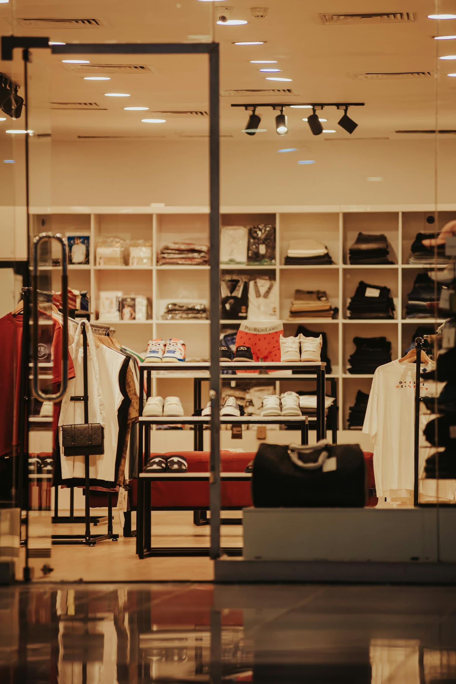 Clean Highlands retail store interior with apparel and accessories displays