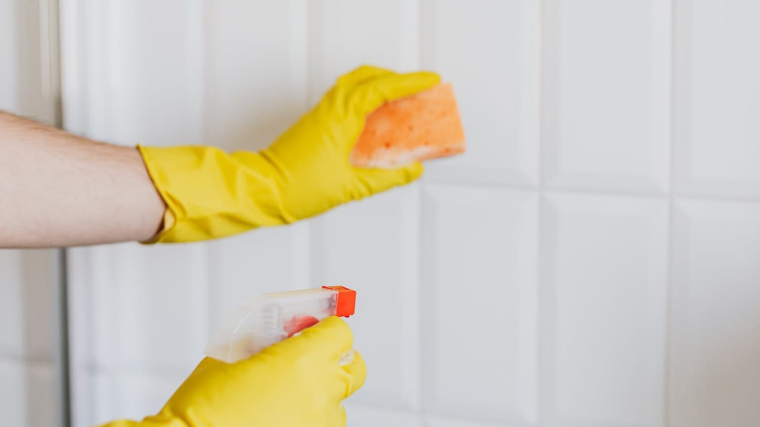Cleaning tile and grout with gloves and a spray bottle